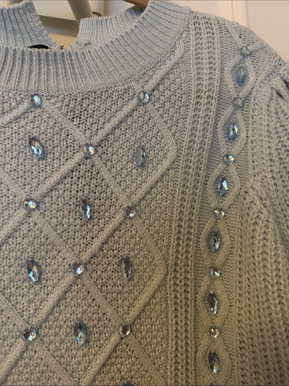 Elegant Light Blue Knit Sweater with Embellishments